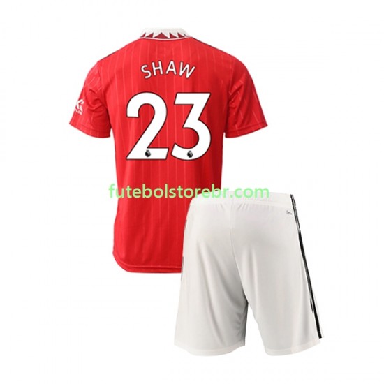 Camisa Manchester United Luke Shaw 23 I 2022-2023 manga curta pro Juvenil